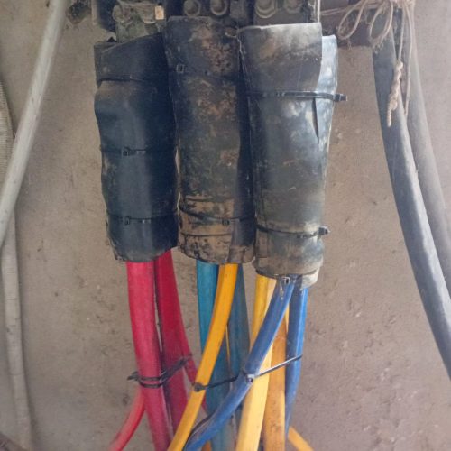 A circuit breaker box with multiple wires connected, showcasing electrical system's organization.